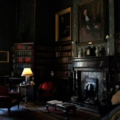 a living room filled with furniture and bookshelves next to a painting on the wall