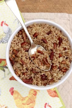 a bowl filled with oatmeal sitting on top of a colorful table cloth