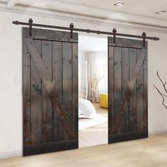 an open sliding barn door in a bedroom