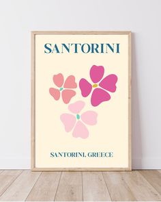 a poster with the name san antonioi in pink and blue on it, against a white wall