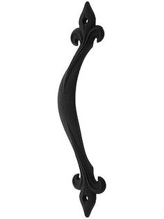 an ornate black door handle on a white background