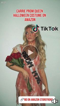 a woman dressed as a zombie holding roses