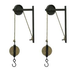 two black metal hooks with rope attached to each other on a white background, side by side