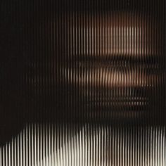 a man's face is shown through the lines in this photo, as if it were made out of corrugated