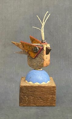 Reclaimed small bird sculpture sitting on half a billiard ball with old yard stuck wings. Wood Birds, Robot Craft, Yard Sticks, Diy Crafts To Do