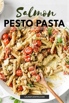 pasta with chicken, tomatoes and parmesan cheese in a white bowl