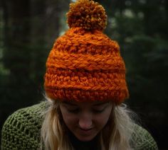 a woman wearing an orange knitted hat