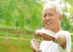 an older man is playing with a frisbee in the park royalty images and stock photos