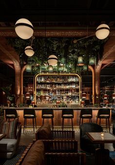 the bar is decorated with plants and lights