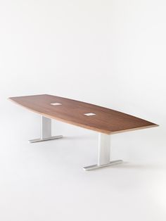 a wooden surfboard sitting on top of a metal stand