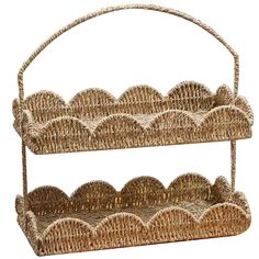 two wicker baskets with handles are stacked on each other