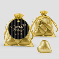 two gold foil bags with black and white stripes on the front, one is filled with chocolate