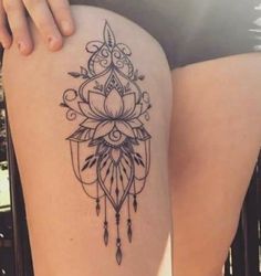 a woman's thigh with a tattoo on it