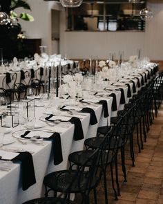 the tables are set with black and white linens