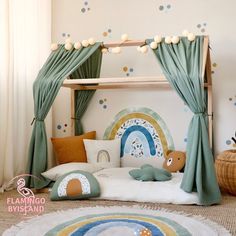 a child's bedroom with a canopy bed, pillows and rugs on the floor