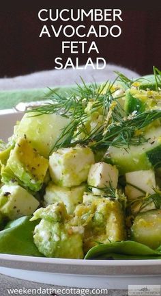 cucumber avocado feta salad in a white bowl on a table