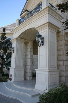 an entrance to a house with steps leading up to it