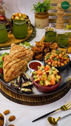 a platter filled with lots of food on top of a table