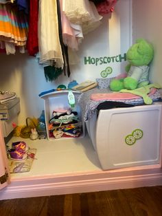 the closet is full of children's clothing and toys