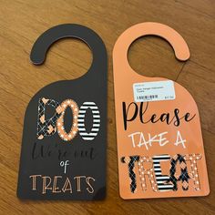 two door hangers that say, please we're out of treats and 30