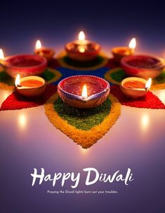 happy diwali greeting card with lit candles in the middle and colorful carpet on the floor