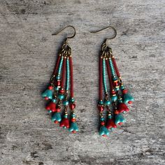 Beautiful and original red and pale blue tones, bronze bohemian Czech glass leaf earrings.  Spiritual Jewelry designed and carefully handmade by Rushweaver Jewellery in an ancient earthy tribal style.  These boho beauties dangle 78mm from the top of nickel free brass ear wires. For all free spirited women who want to enjoy their unique style! Bohemian Chandelier Earrings With Ear Wire For Festivals, Red Bohemian Dangle Flower Earrings, Bohemian Handmade Dangle Earrings, Bohemian Turquoise Beaded Earrings With Brass, Bohemian Turquoise Beaded Earrings In Brass, Bohemian Drop Earrings, Bohemian Turquoise Earrings For Festival, Bohemian Turquoise Beaded Brass Earrings, Bohemian Turquoise Beaded Earrings