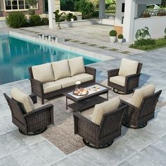 an outdoor patio furniture set near a swimming pool