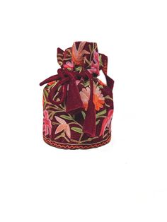 Complete your traditional looks with this lovely potli bag on your wrist, which is trendy yet compact enough to carry your essentials in style. This potli bag will be a pretty inclusion in your accessory collection and perfect for taking in a party. This bag can also be used as a wedding favour bag. It is perfect as a gift for weddings, bridal showers, baby showers, and wedding receptions - excellent to fill with candy, dry fruits, sweets, herbs, soap, or something remarkable for your guests that no one will leave behind! Product Details - Condition Brand New - Product: Potli Bag with Drawstrings for closure - Fabric: Fine Velvet - Embroidery: Kashmiri Aari Jaal Work - Colour: Maroon - Size: 7″ High and 5″ Base (18 cms High and 13 cms Base) approx. - Product Care: Dry Clean Only If you wan Handheld Box Bag With Dust Bag For Gifts, Red Shoulder Bag For Festive Gift, Festive Red Shoulder Bag As Gift, Festive Red Shoulder Bag For Gifts, Embroidered Pouch For Festivals, Red Shoulder Bag As Festival Gift, Embroidered Festival Pouch, Red Shoulder Bag For Festivals As Gift, Traditional Clutch Evening Bag With Floral Embroidery