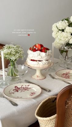 a table topped with plates covered in cake and flowers