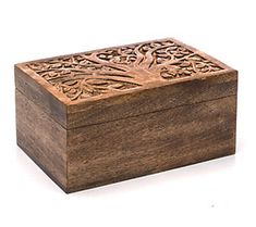 a wooden box with carvings on it