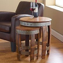 two stools and a table with a bottle of wine on it