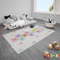 a child's playroom with toys on the floor and rug in front of it