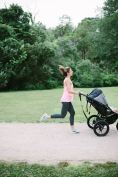 a woman jogging with her baby in a stroller