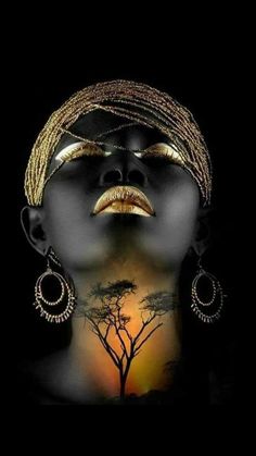 an african woman with her face painted gold