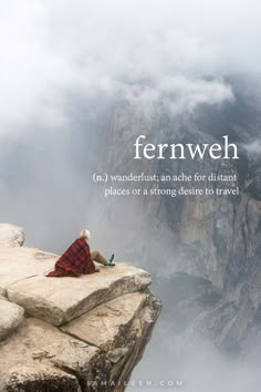 a person sitting on top of a cliff with the words fernweh above them