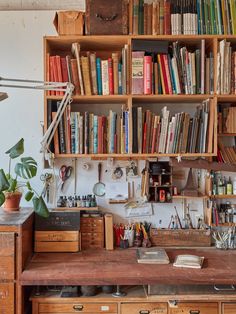 an old desk with many books on it