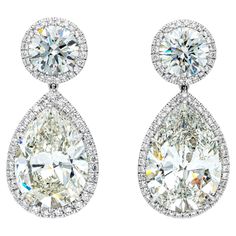 An elegant and magnificent pair of dangle earrings, featuring GIA certified pear shape diamonds weighing 24.32 carats total with K color and SI clarity, suspended from round brilliant cut diamonds weighing 5.22 carats total with K color and VS1-VS2 clarity. Each stone is set with a halo of round melee diamonds weighing 2.59 carats total. Finely made with polished platinum. Roman Malakov is a custom house, specializing in creating anything you can imagine. If you would like to receive a special quote on a custom piece, please message or call us. Lux Jewelry, Alexis Bittar Jewelry, Diamond Dangle Earrings, Custom House, Mom Jewelry, Expensive Jewelry, Gold Diamond Earrings, Ruby Earrings, Fancy Jewelry