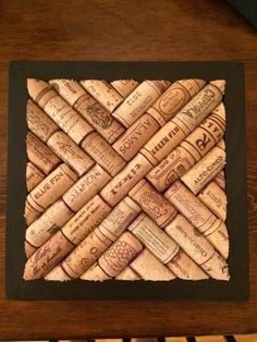 a close up of a bunch of wine corks in a frame on a table