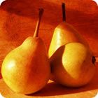 two pears sitting on top of a wooden plate