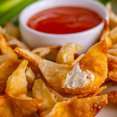 some fried food on a plate with dipping sauce