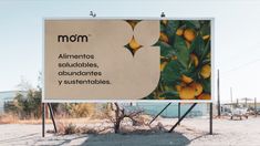 a large sign advertising lemons on the side of a road in front of an industrial area