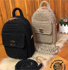 two crocheted backpacks sitting next to each other