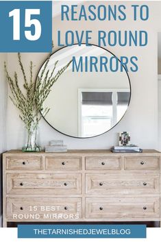 a round mirror sitting on top of a dresser