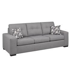 a gray couch with two pillows on it