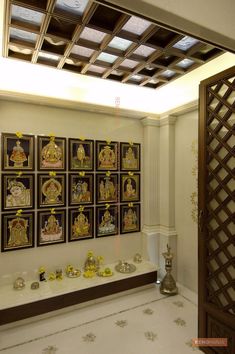 there are many pictures on the wall in this room, and one is decorated with gold