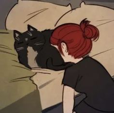 a woman laying in bed with a black cat next to her on top of the pillow