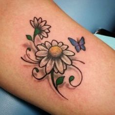 a woman's thigh with flowers and butterflies on it