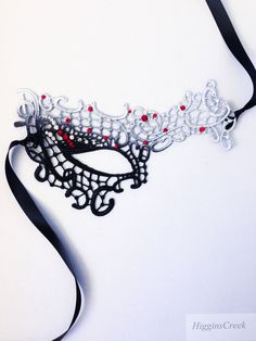 Masquerade Ball Masks Custom made and embellished to match your formal masquerade Party dress or costume. Intricately designed in the half face shape. All Masks come with either matching Ribbons or Stretched Lace. Base Material - Embroidered Lace Mask. All Masks come with either matching Ribbons or Stretched Lace. You may leave a note during checkout if you have a preference. Mask is available in left eye or right eye covered mask. You can leave a note during check out if you have a preference. Fantasy Halloween Masks For Gift, Fantasy Halloween Masks As Gifts, Fantasy Style Halloween Masks As Gifts, Adjustable Masquerade Mask For Costume Party, Adjustable Masquerade Mask Costume Accessories, Gothic Adjustable Masquerade Mask, Handmade Halloween Masks As Gifts, Adjustable Black Masquerade Mask For Carnival, Black Adjustable Masquerade Mask For Carnival