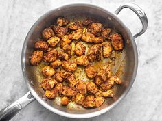 a pan filled with some food on top of a table