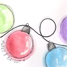 three colored christmas ornaments on a white surface